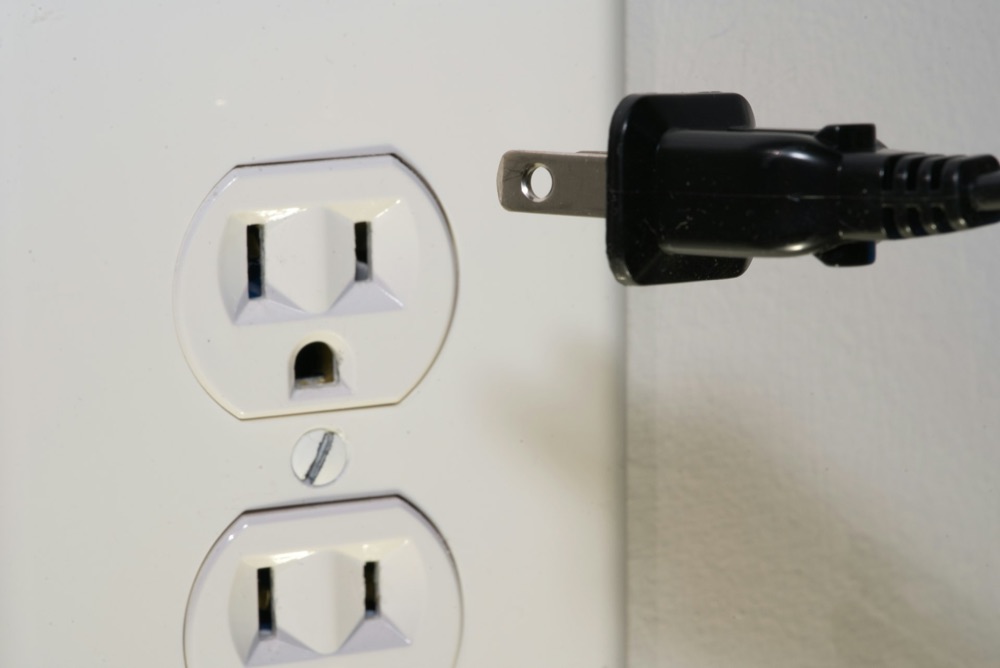 Electrician running residential wiring in a shoreline home renovation